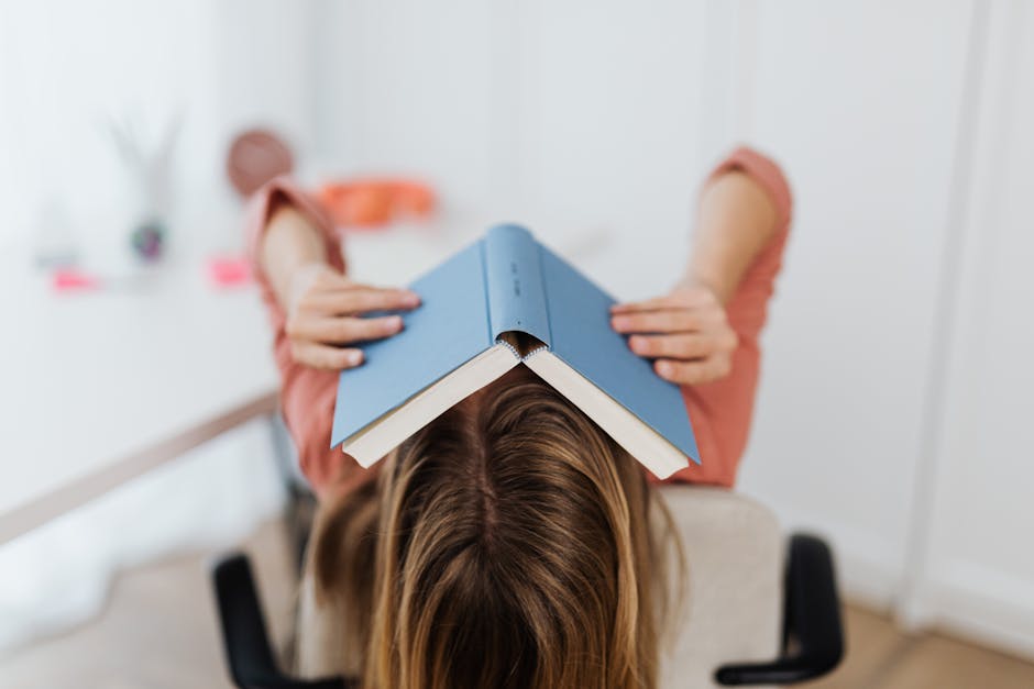 Person taking a break and stretching at desk